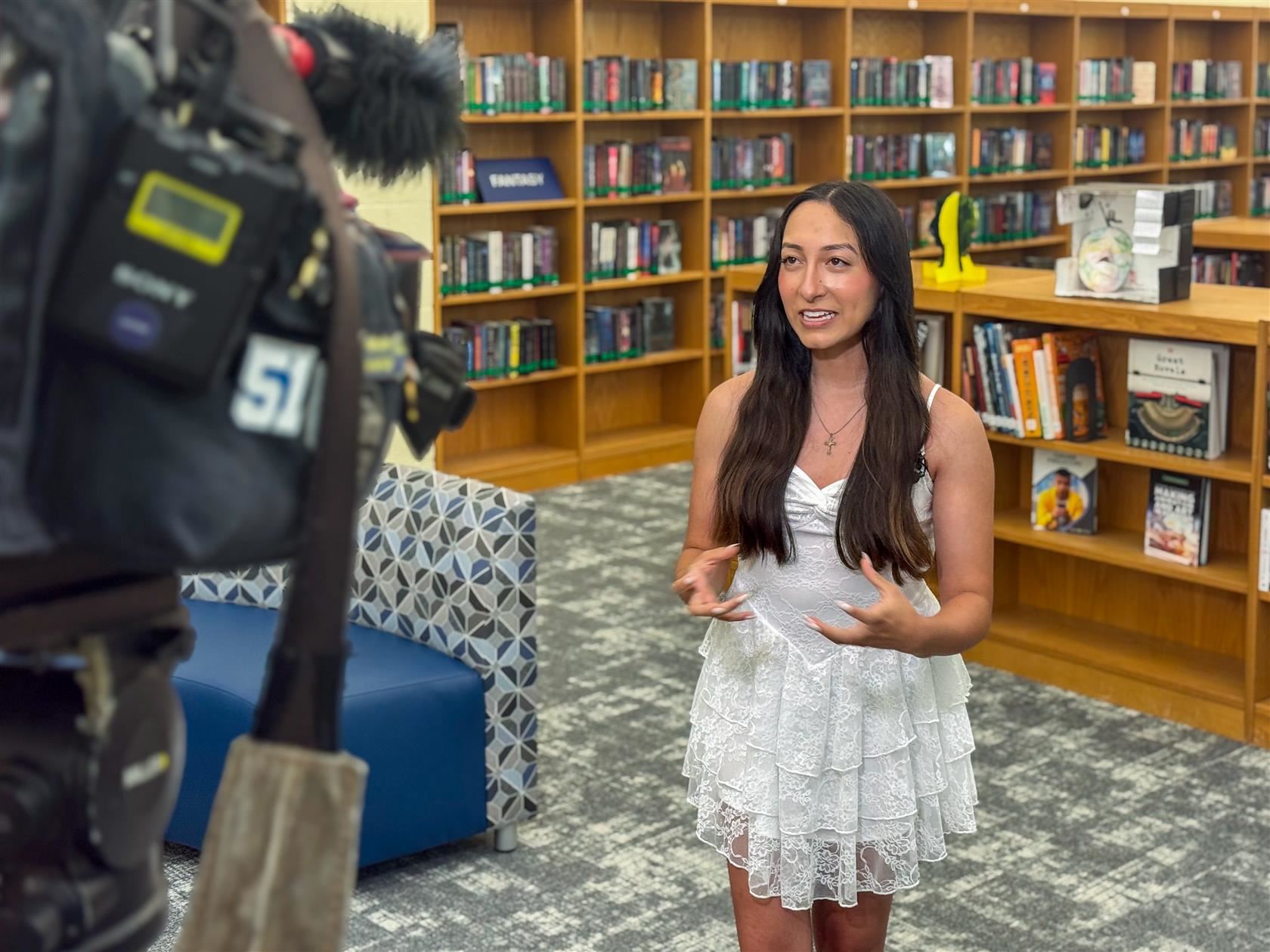  Brianna Castro, Charlotte-Mecklenburg Virtual School senior speaks with news reporter